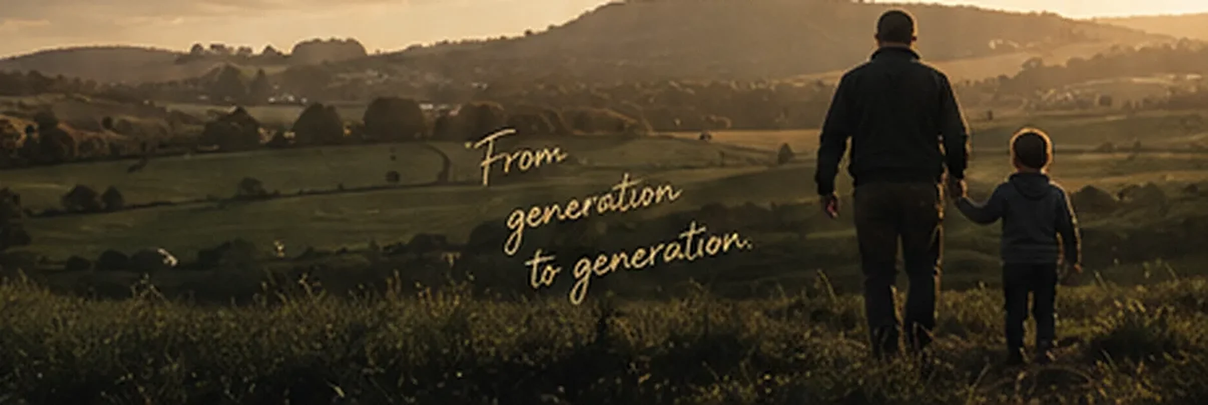 Two generations walking the land together at evening. From generation to generation.